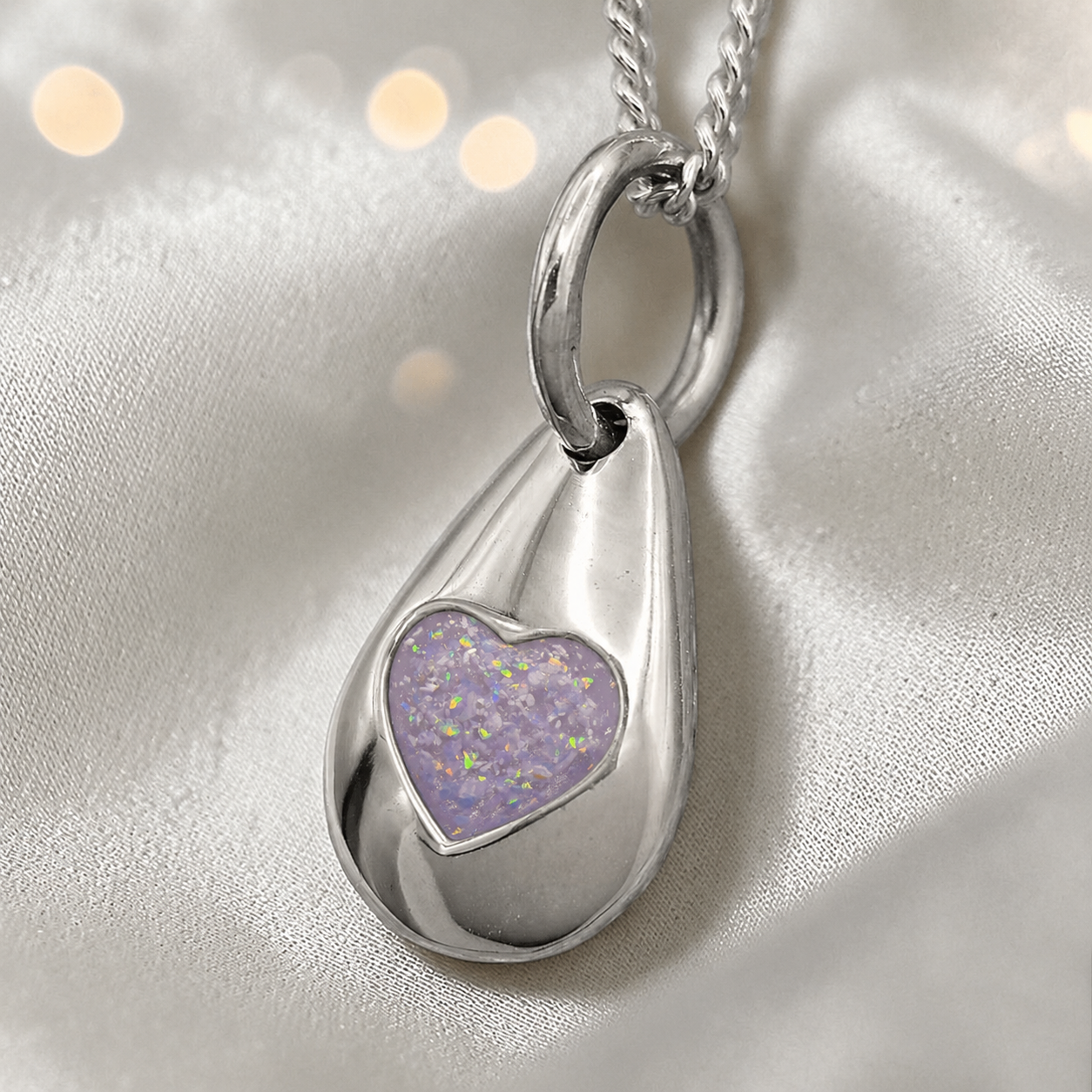 Gacrux pebble shaped pendant with heart memorial stone in unicorn purple, handcrafted in Lancashire UK - by Keepsake Memorial Jewellery