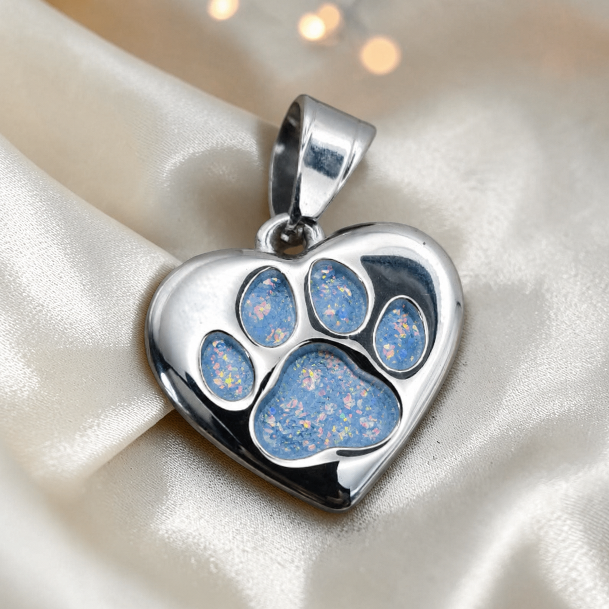 Milo paw keyring ashes charm in baby blue, handcrafted in Lancashire UK - by Keepsake Memorial Jewellery