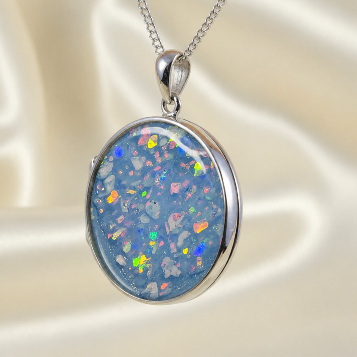 Mirfa large round silver memorial locket in baby blue, handcrafted in Lancashire UK - by Keepsake Memorial Jewellery