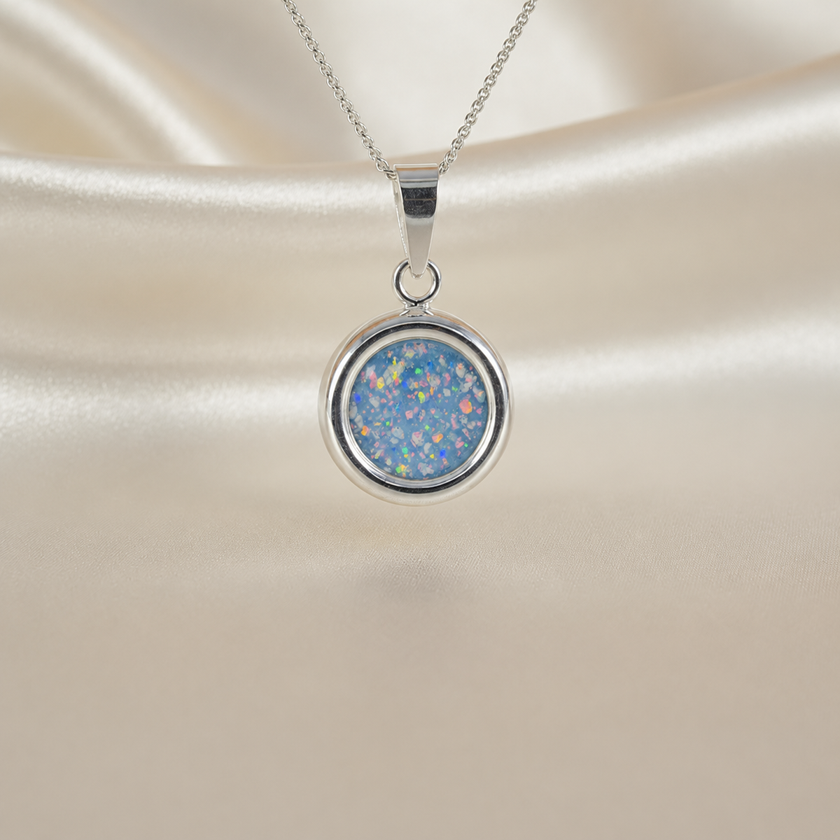 Pollux silver round memorial pendant, in baby blue, handcrafted in Lancashire UK