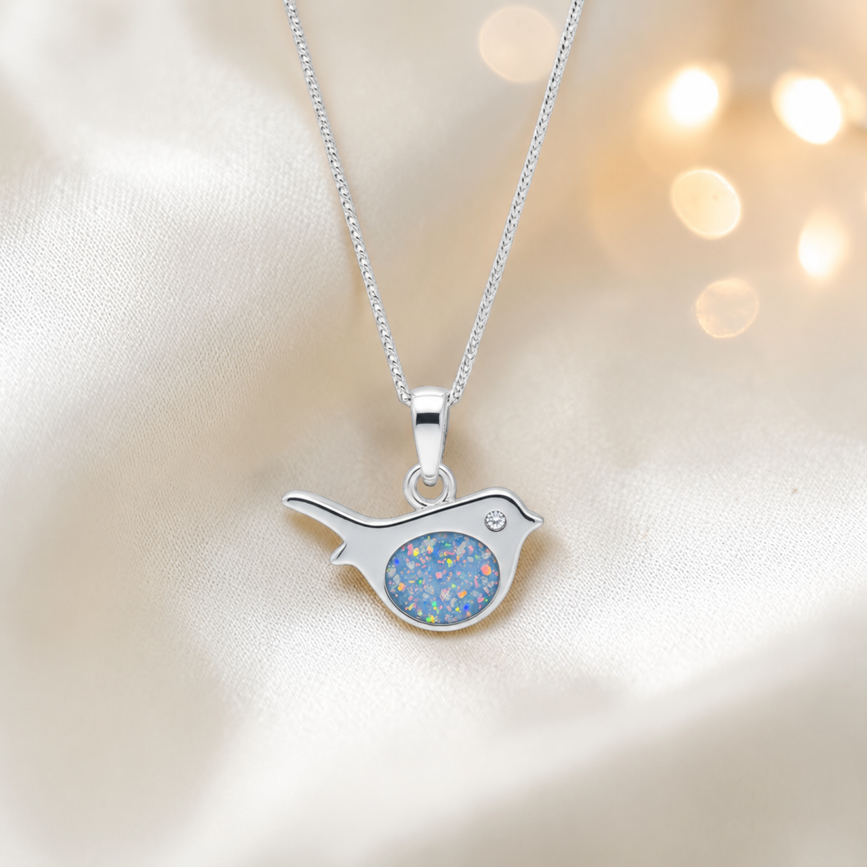 Robin bird shaped white gold memorial pendant in baby blue, handcrafted in Lancashire UK - by Keepsake Memorial Jewellery