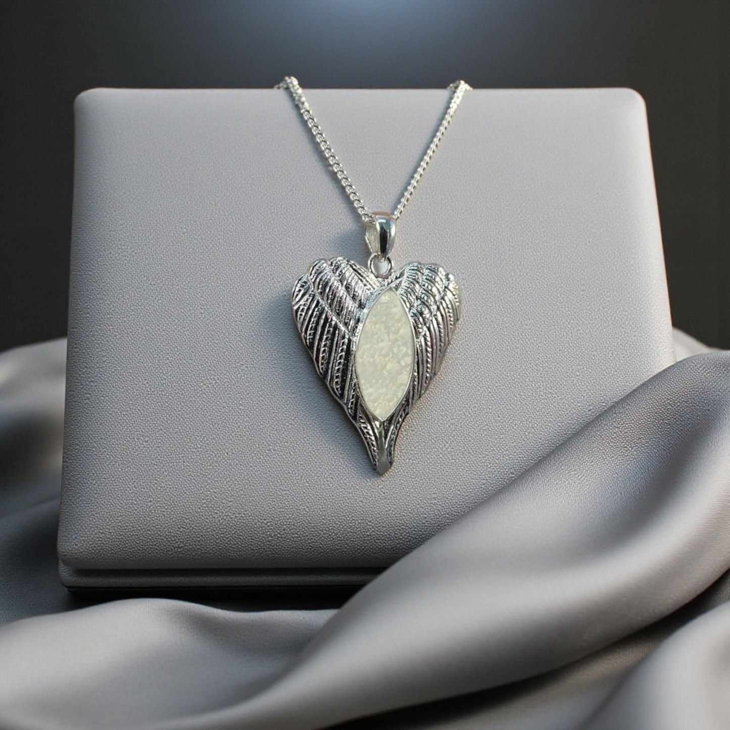 Silver angel wing memorial keepsake pendant, handcrafted in Lancashire UK