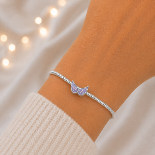 Unicorn purple sterling silver angel wing ashes memorial charm, handcrafted in Lancashire by keepsake memorial