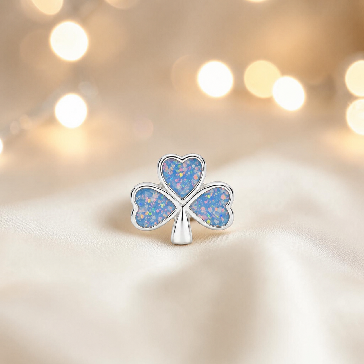 Baby blue sterling silver shamrock ashes memorial charm, handcrafted in Lancashire by keepsake memorial