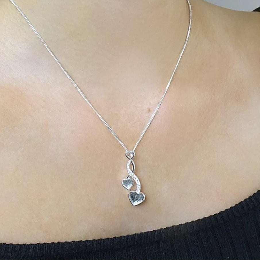Striking Solid 925 Two Silver Entwined Hearts With CZ Stones