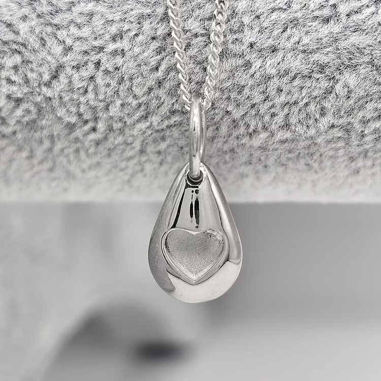 Silver pebble memorial pendant, handcrafted in Lancashire, UK