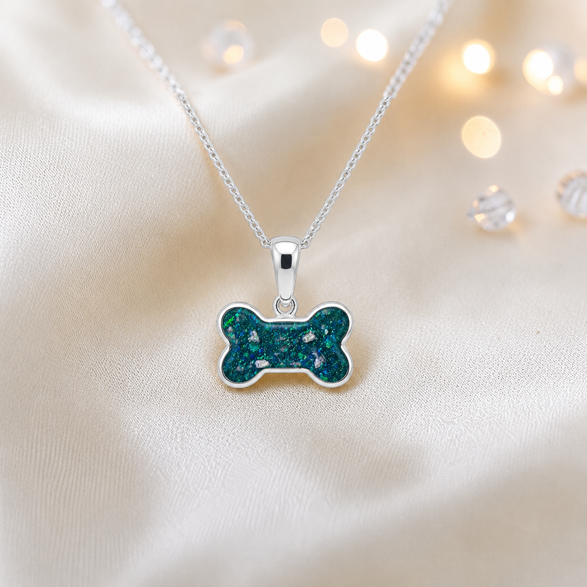 Teal mist Milo sterling silver dog bone memorial pendant, handcrafted in Lancashire UK by Keepsake Memorial Jewellery