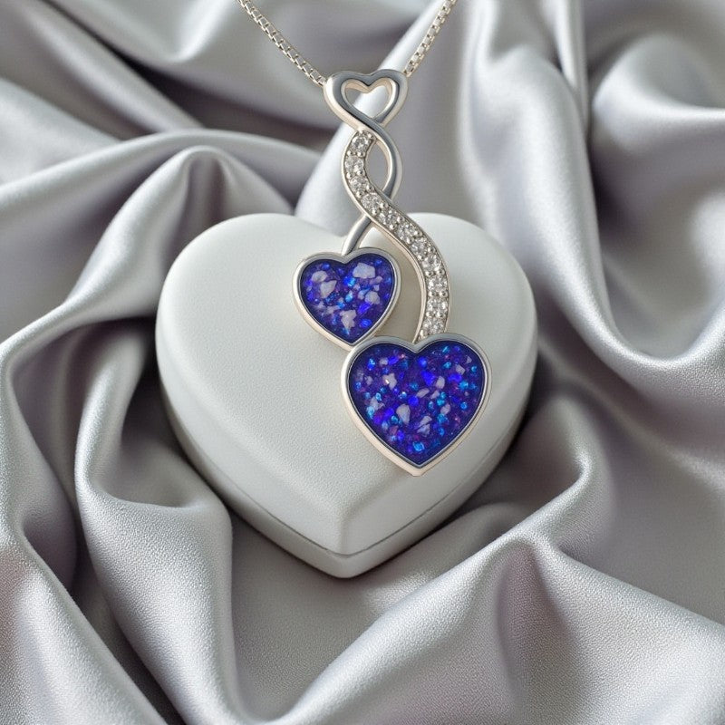 Silver twin heart keepsake pendant, handcrafted in Lancashire, UK