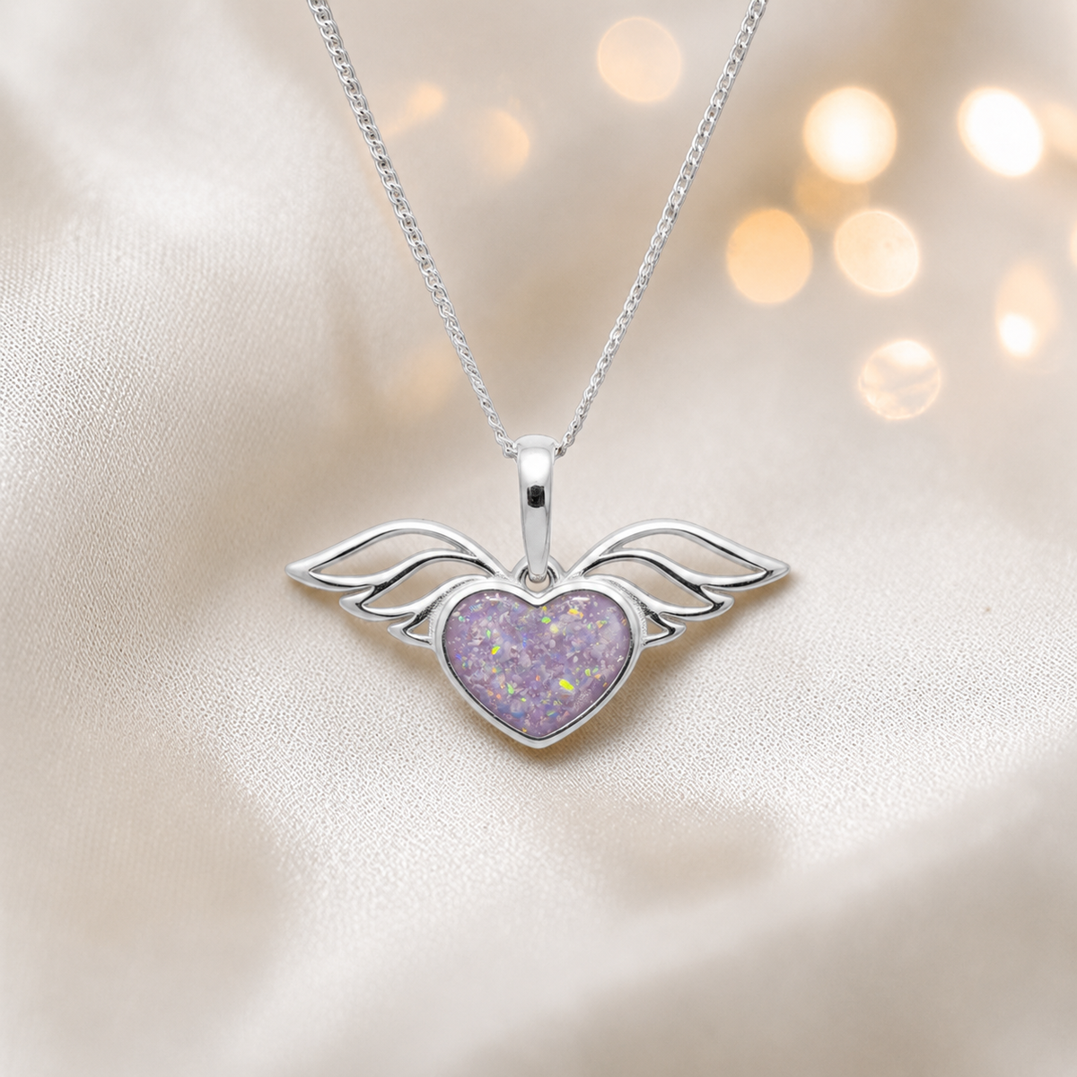 Angel wing heart memorial ashes pendant in unicorn purple, handcrafted in Lancashire UK