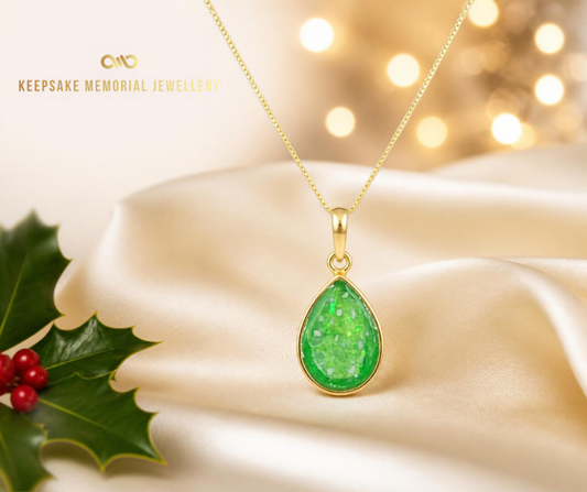 Gold pear shaped pendant advertising christmas blog. Handcrafted in Lancashire UK by Keepsake Memorial Jewellery