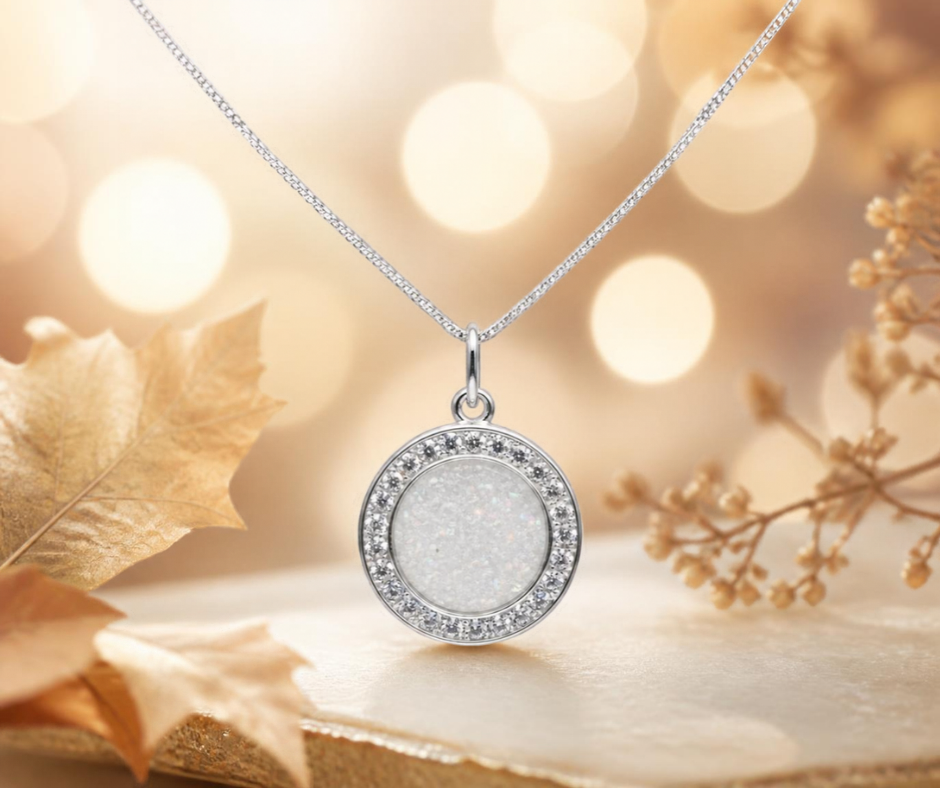 Zosma round memorial locket with CZ stones in white snow, handcrafted in Lancashire UK  by Keepsake Memorial Jewellery