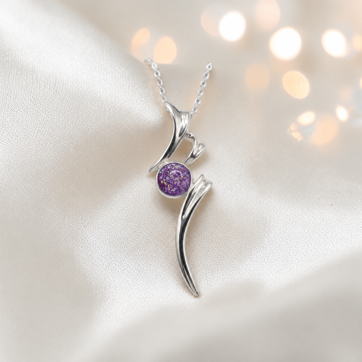 Abstract silver memorial ashes pendant in rose pink, handcrafted in Lancashire UK