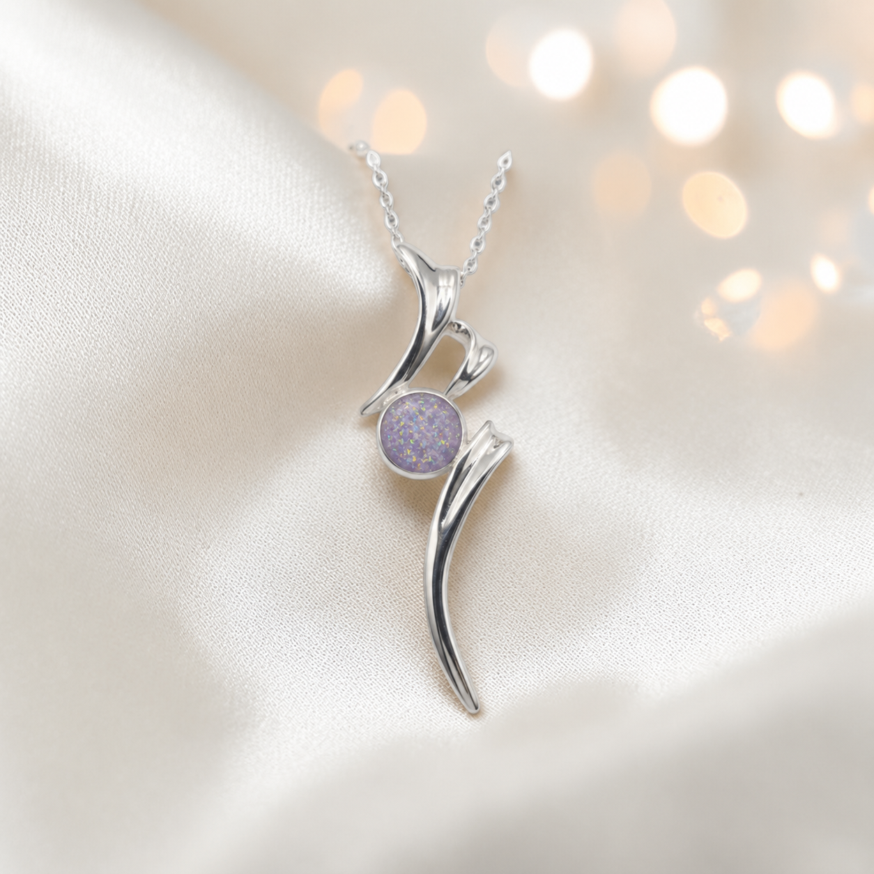 Abstract silver memorial ashes pendant in unicorn purple, handcrafted in Lancashire UK