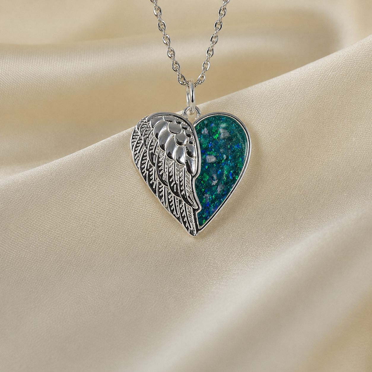 Achern angel heart ashes pendant in teal mist, handcrafted in Lancashire UK - by Keepsake Memorial Jewellery