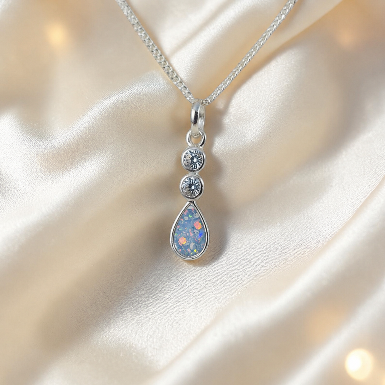 Acrux small tear drop CZ ashes pendant in baby blue, handcrafted in Lancashire UK