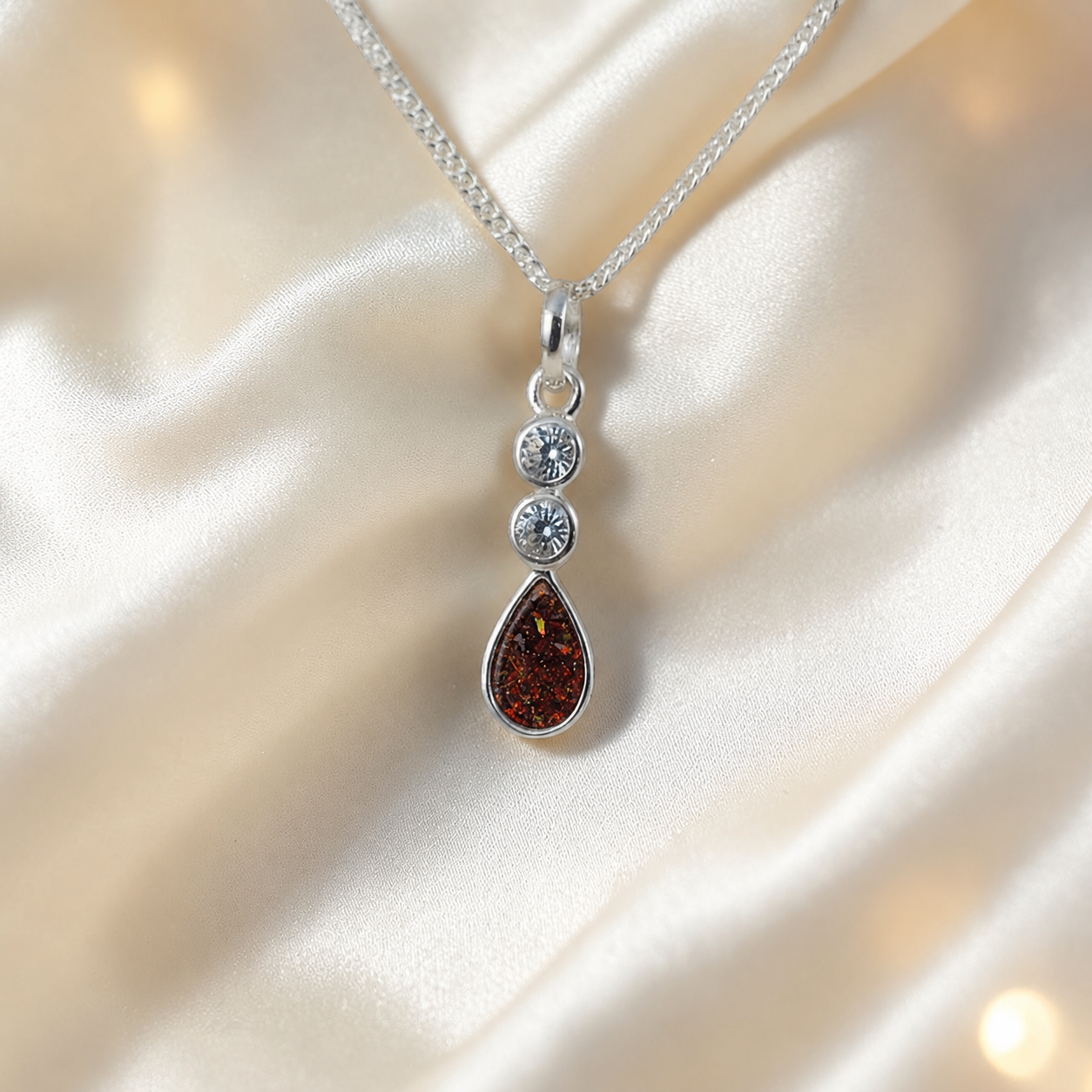 Acrux small tear drop CZ ashes pendant in copper mocha, handcrafted in Lancashire UK