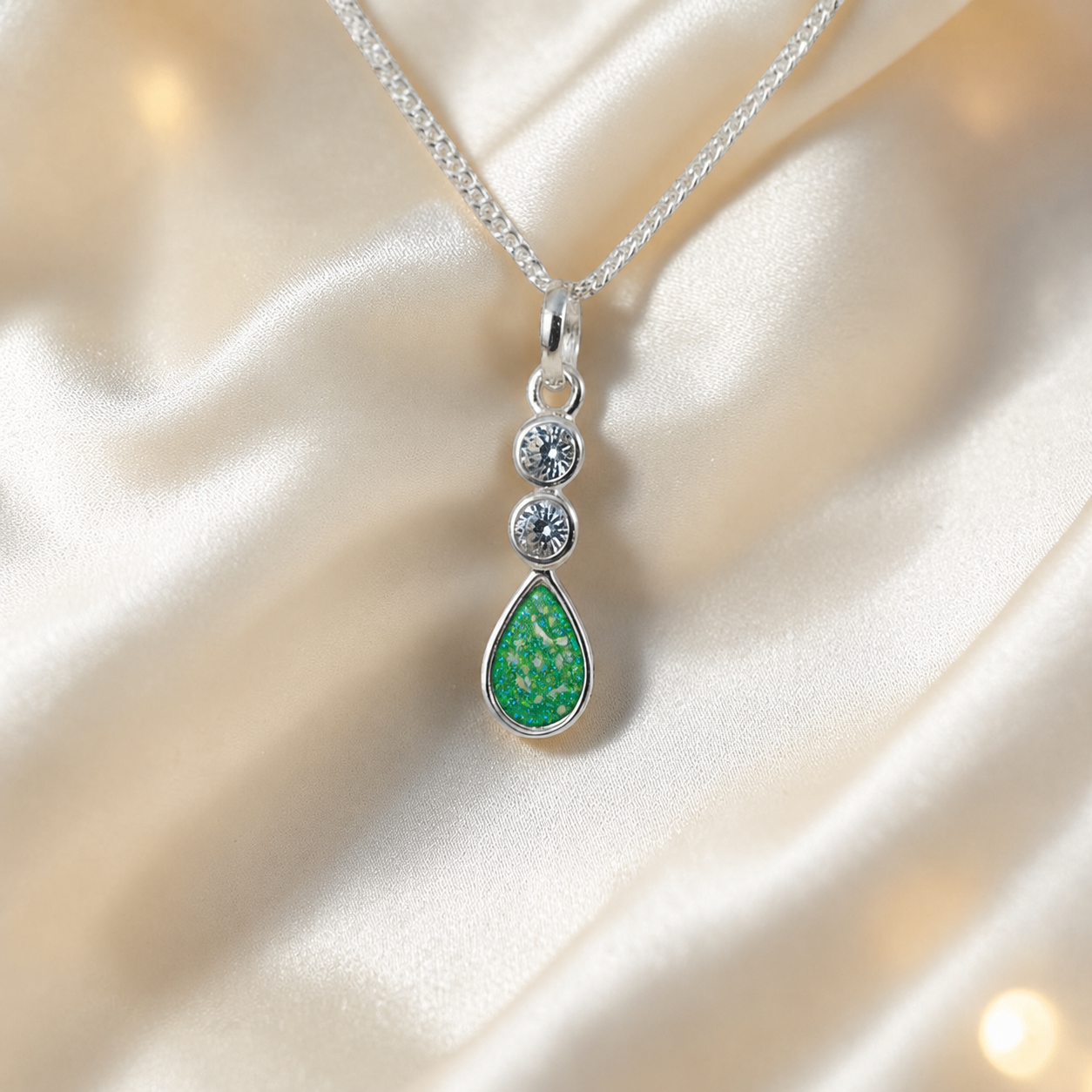 Acrux small tear drop CZ ashes pendant in fruit green, handcrafted in Lancashire UK