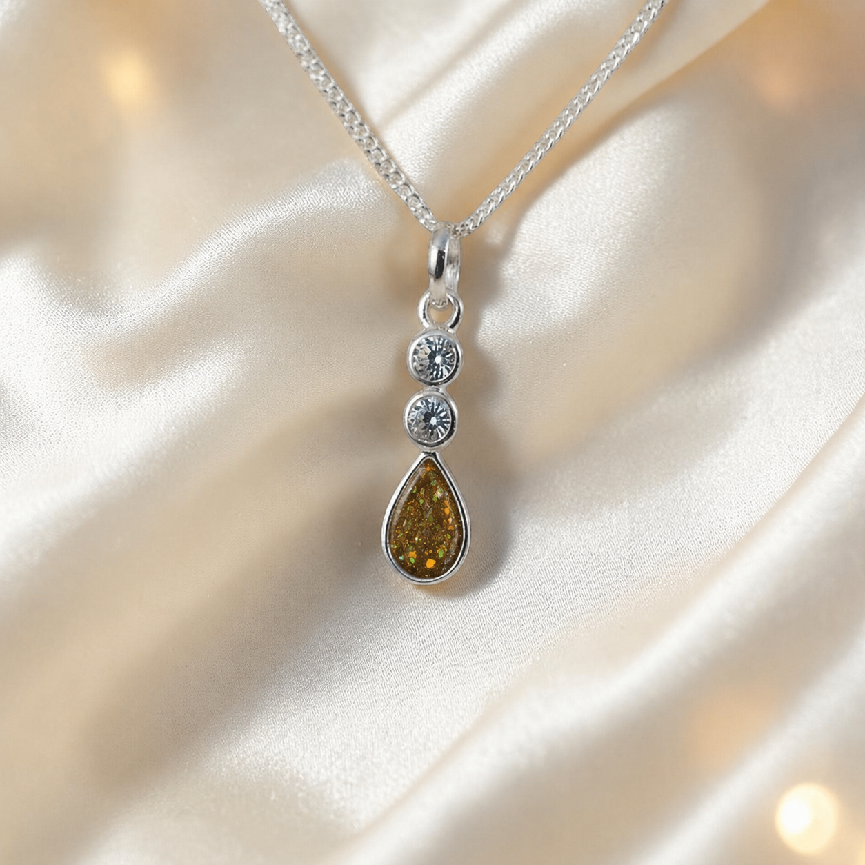 Acrux small tear drop CZ ashes pendant in gold olive, handcrafted in Lancashire UK
