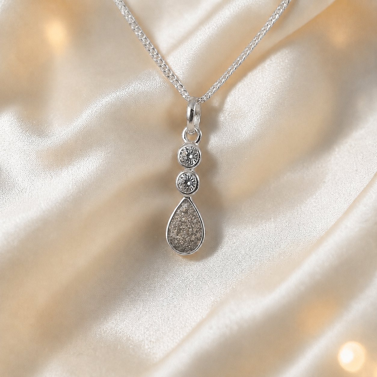 Acrux small tear drop CZ ashes pendant in natural ash, handcrafted in Lancashire UK