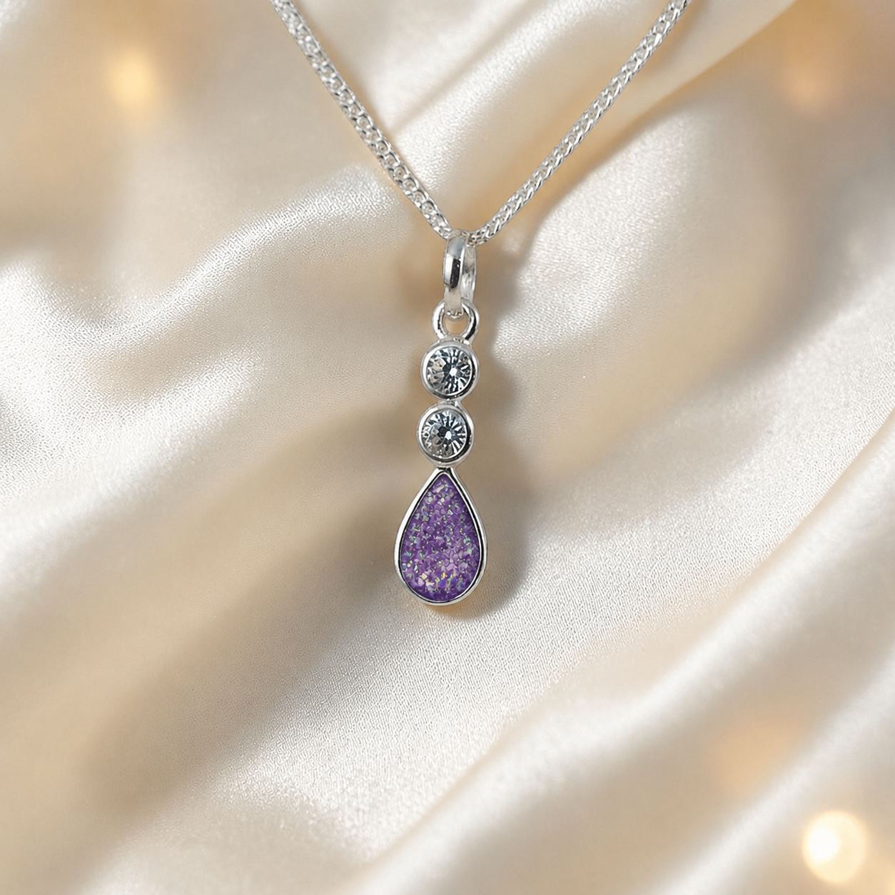 Acrux small tear drop CZ ashes pendant in rose pink, handcrafted in Lancashire UK