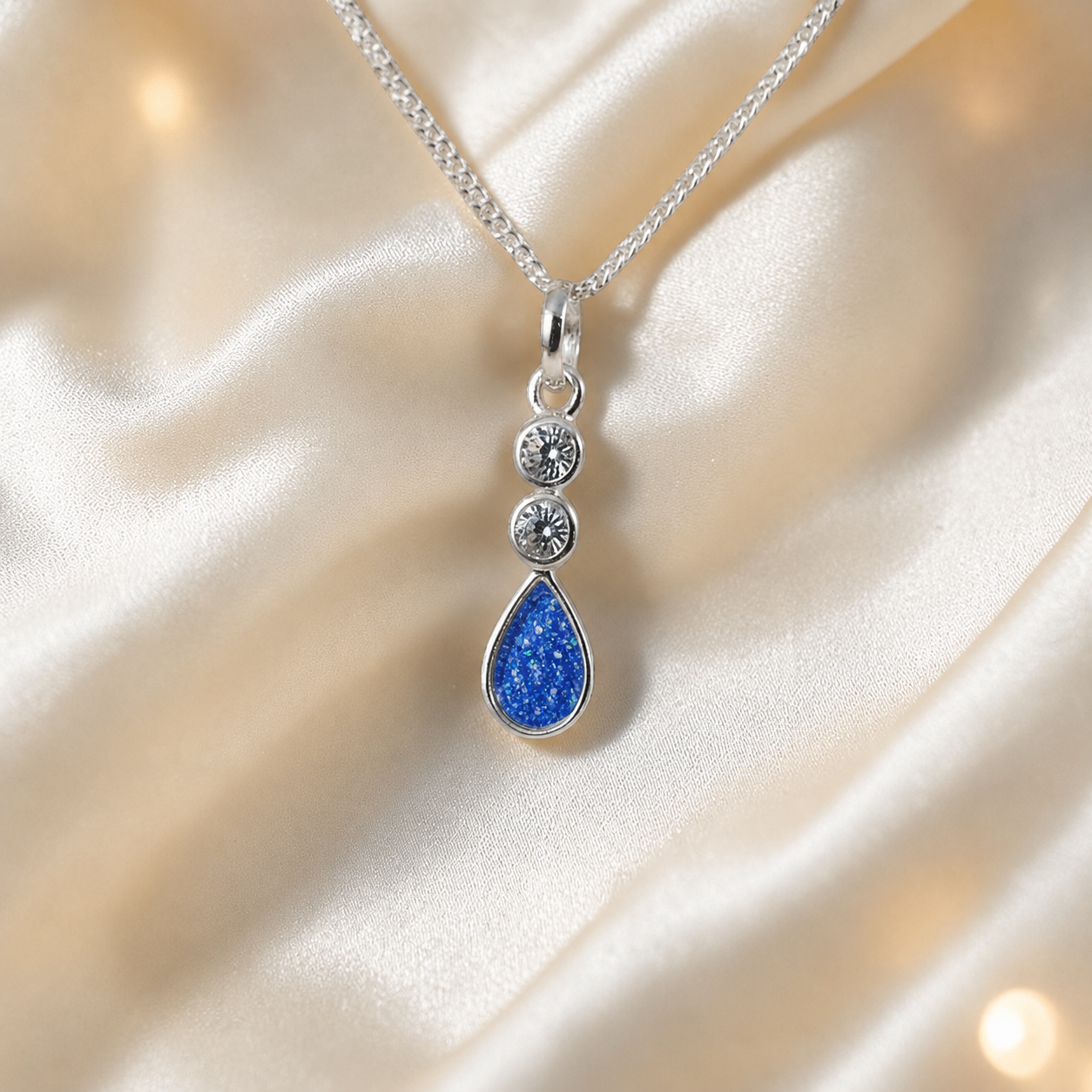 Acrux small tear drop CZ ashes pendant in royal blue, handcrafted in Lancashire UK