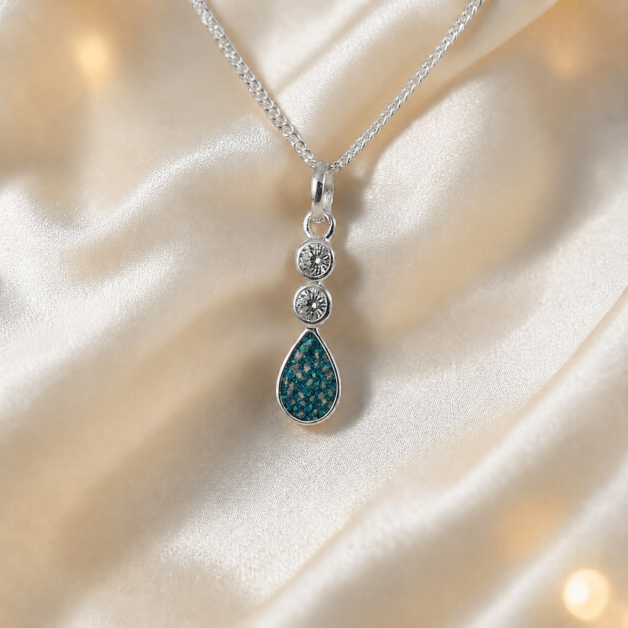 Acrux small tear drop CZ ashes pendant in teal mist, handcrafted in Lancashire UK