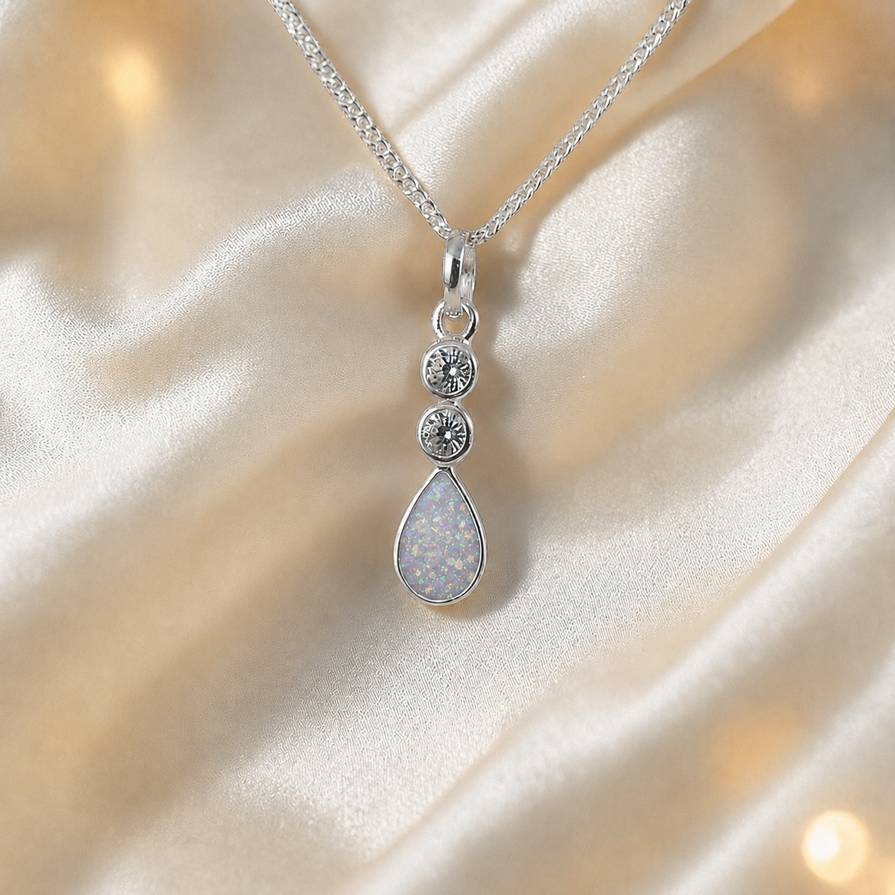 Acrux small tear drop CZ ashes pendant in white snow, handcrafted in Lancashire UK