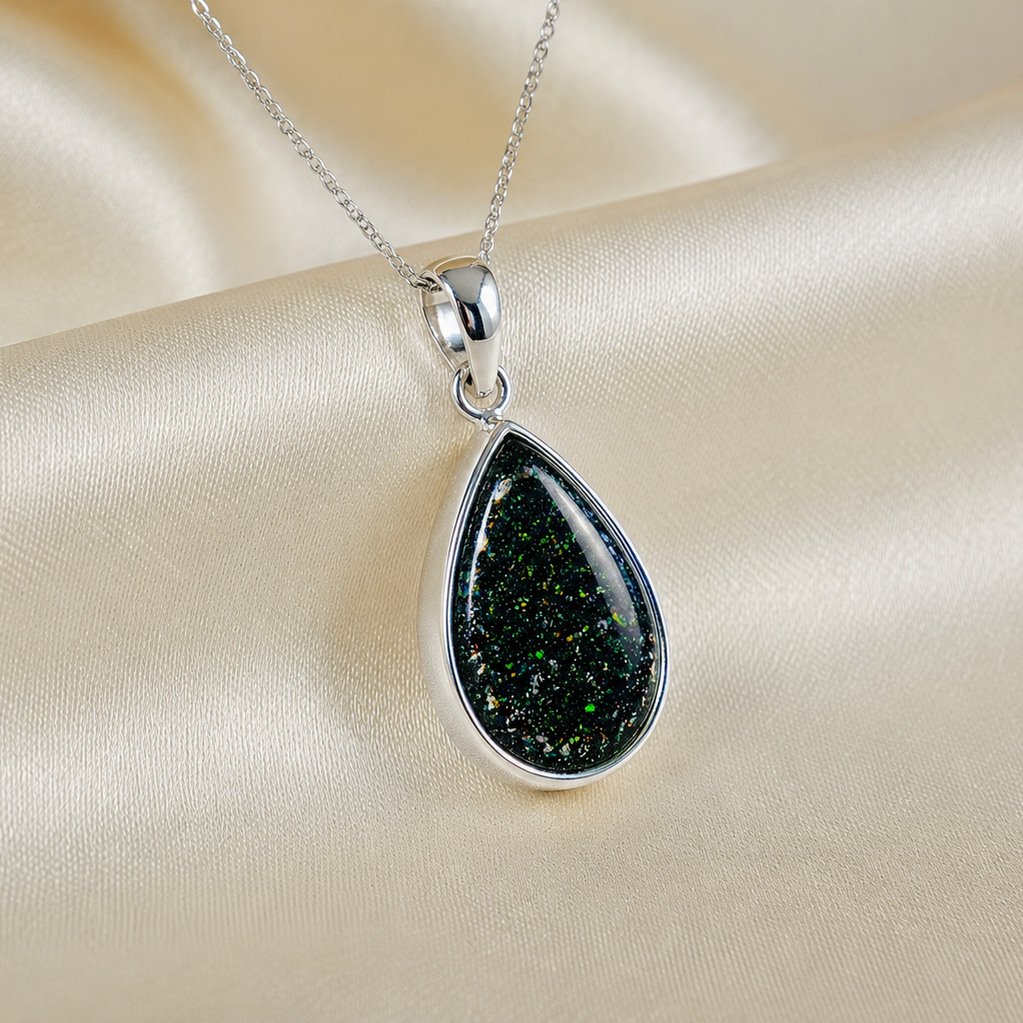 Alcyone pear shaped ashes pendant in black flame, handcrafted in Lancashire UK - by Keepsake Memorial Jewellery