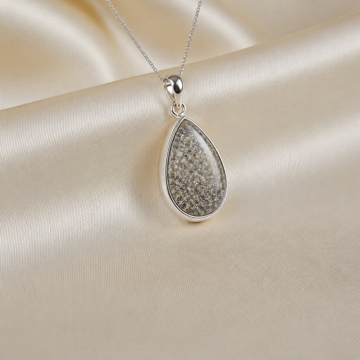 Alcyone pear shaped ashes pendant in natural ash, handcrafted in Lancashire UK - by Keepsake Memorial Jewellery