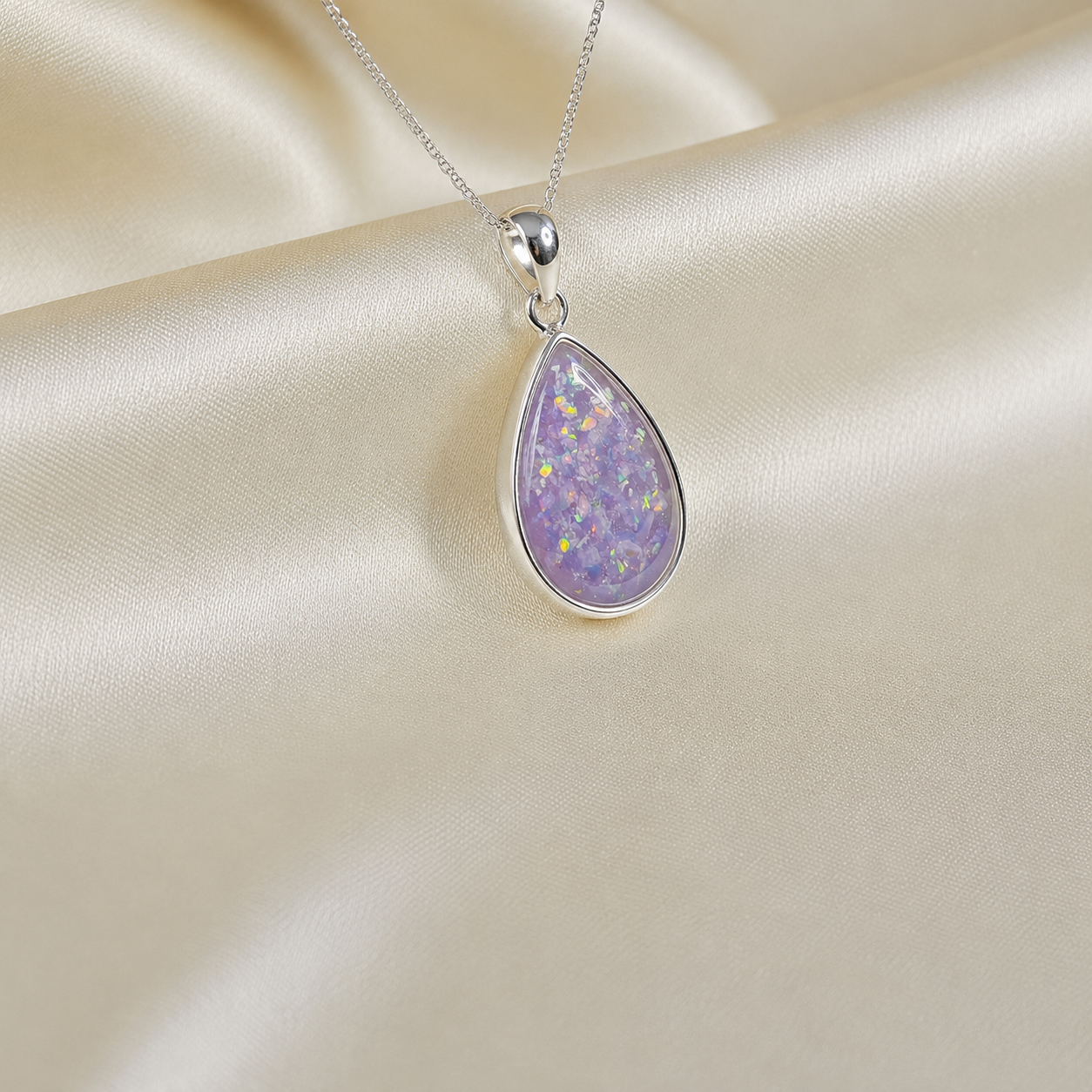 Alcyone pear shaped ashes pendant in unicorn purple, handcrafted in Lancashire UK - by Keepsake Memorial Jewellery