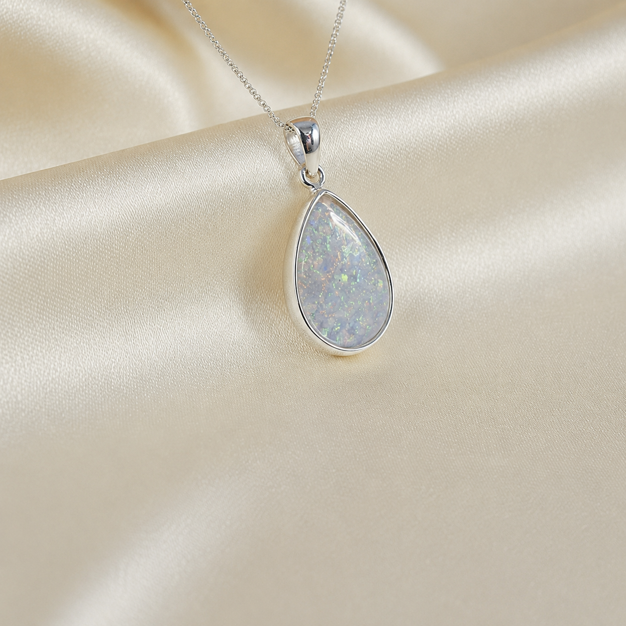 Alcyone pear shaped ashes pendant in white snow, handcrafted in Lancashire UK - by Keepsake Memorial Jewellery