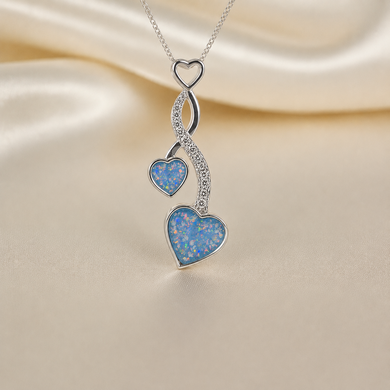 Aldera silver twin heart ashes memorial pendant in baby blue, handcrafted in Lancashire UK