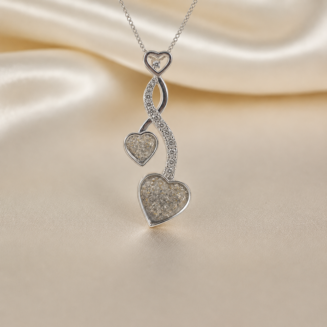 Aldera silver twin heart ashes memorial pendant in natural ash, handcrafted in Lancashire UK
