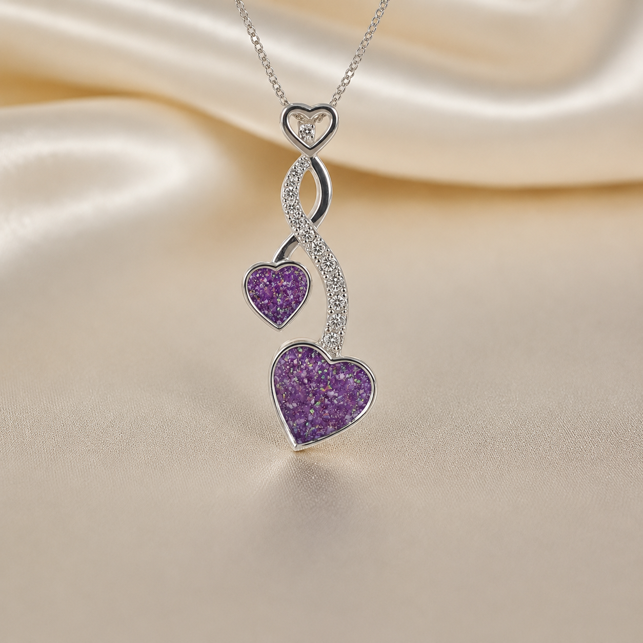 Aldera silver twin heart ashes memorial pendant in rose pink, handcrafted in Lancashire UK