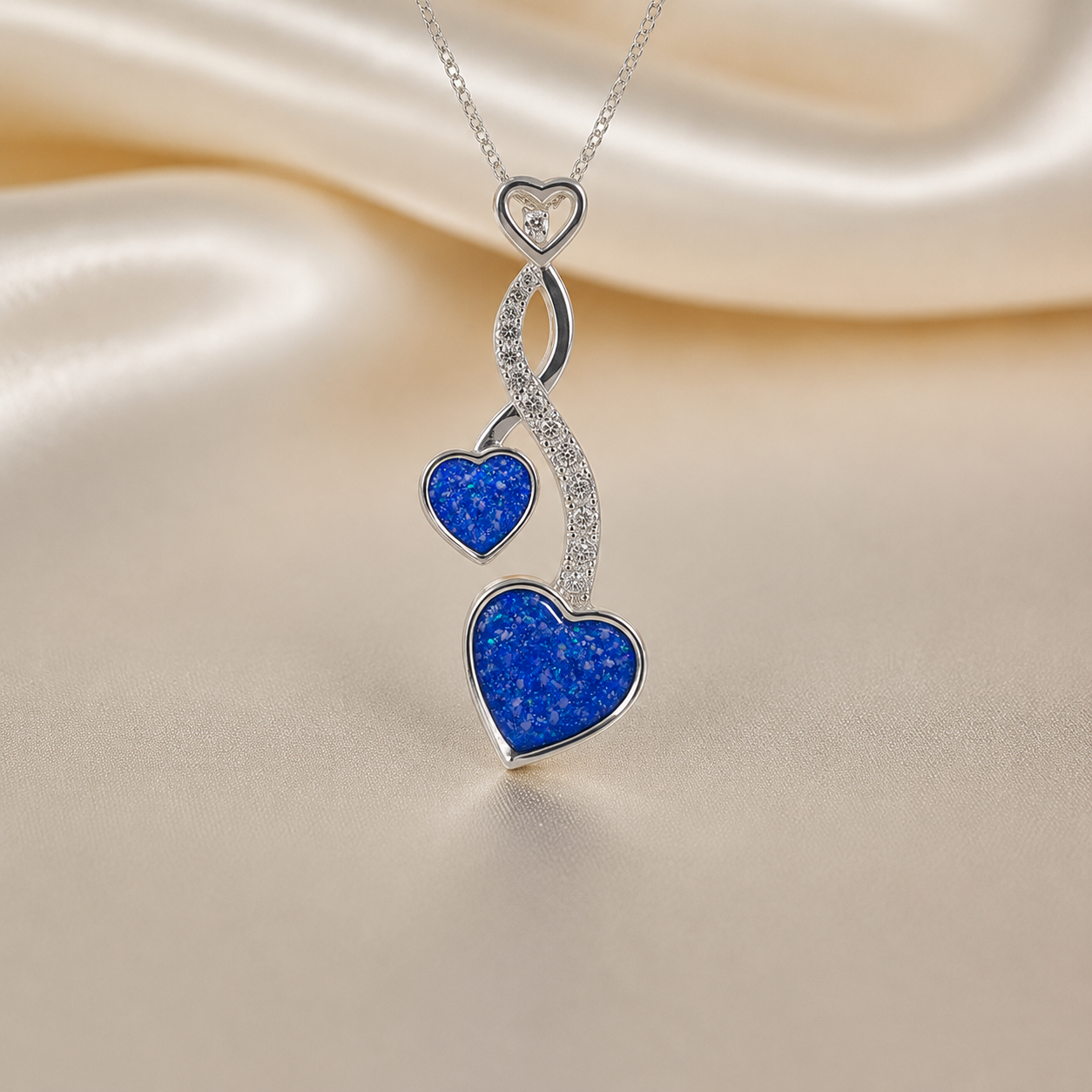 Aldera silver twin heart ashes memorial pendant in royal blue, handcrafted in Lancashire UK