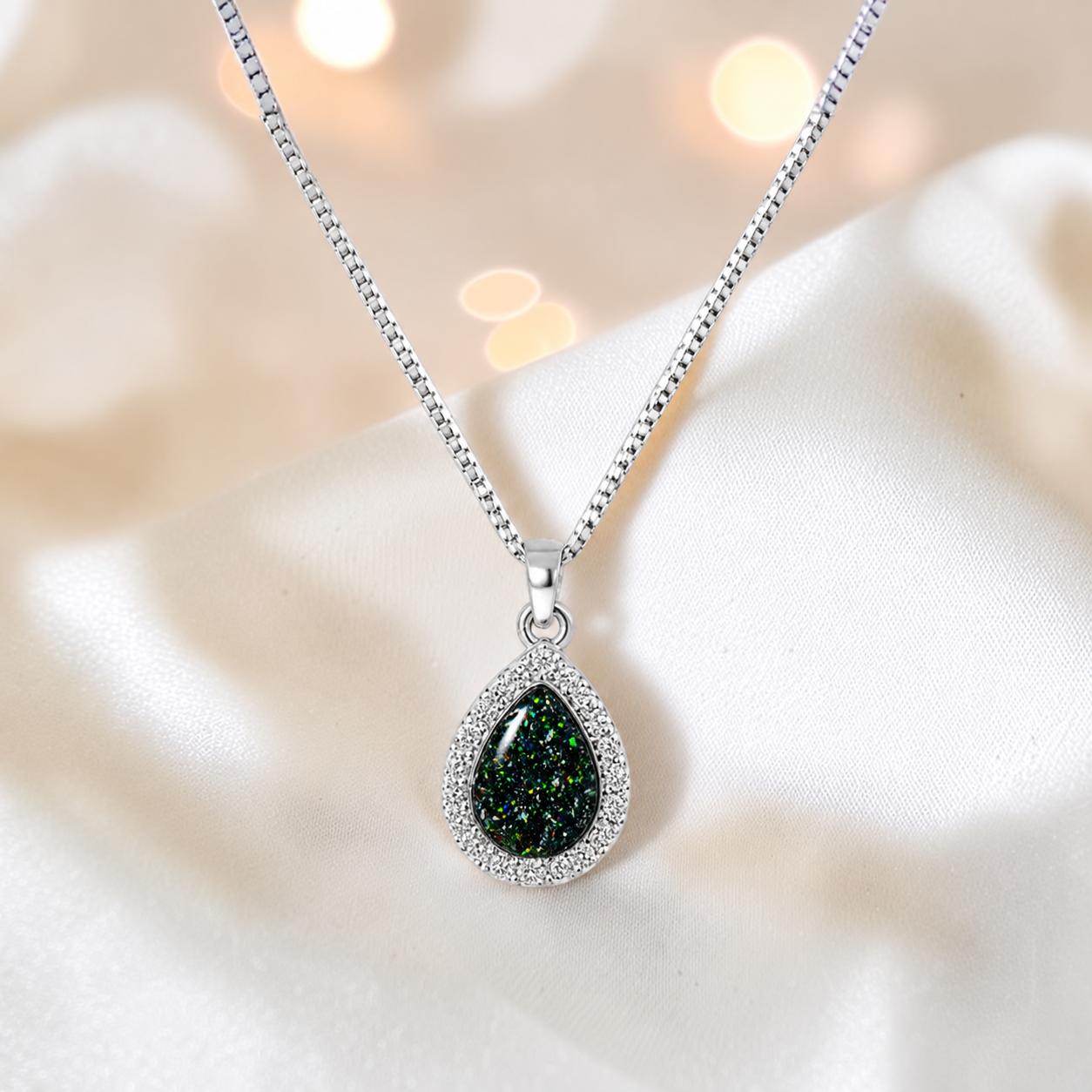 Almara teardrop dainty CZ ashes pendant in black flame, handcrafted in Lancashire UK - by Keepsake Memorial Jewellery