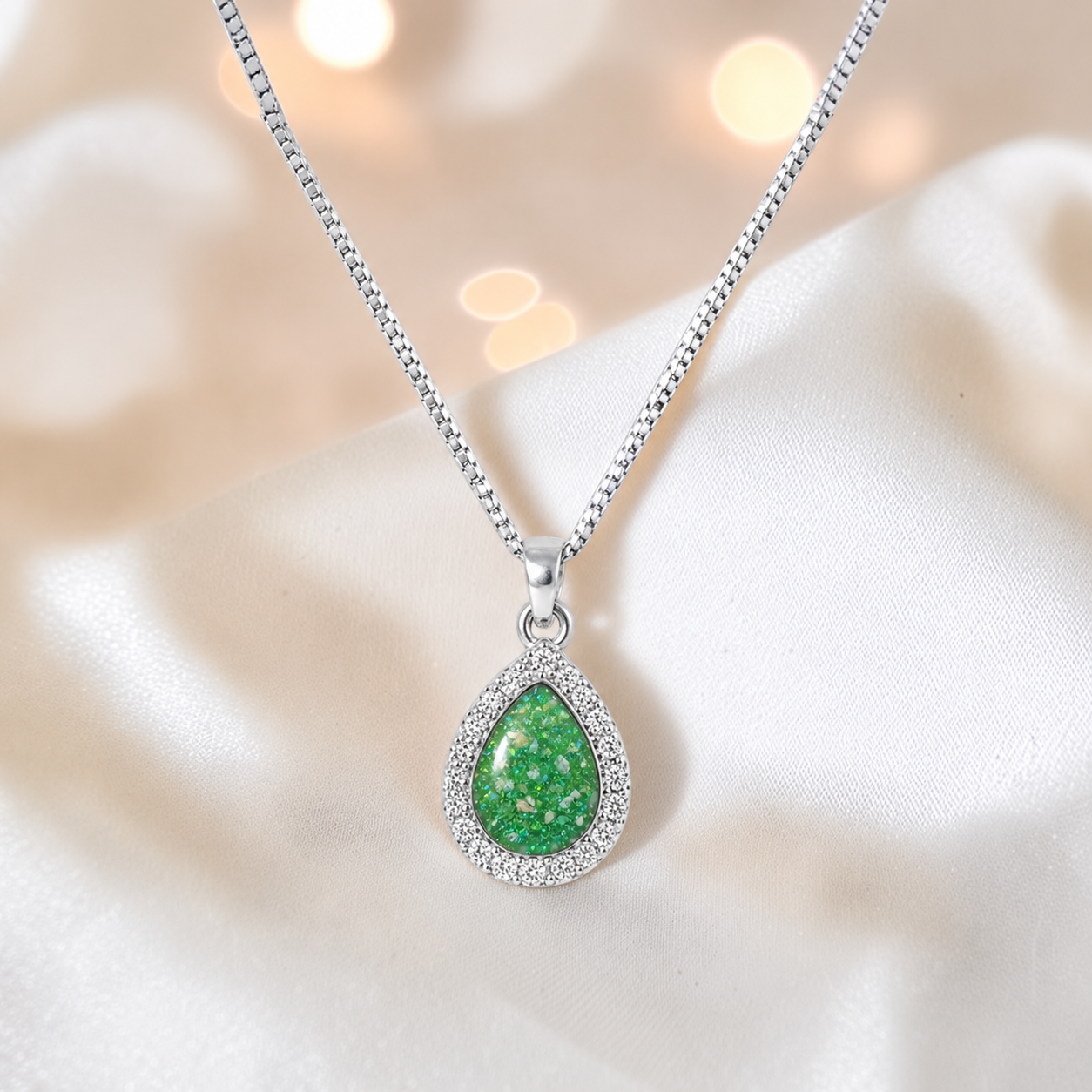 Almara teardrop dainty CZ ashes pendant in fruit green, handcrafted in Lancashire UK - by Keepsake Memorial Jewellery