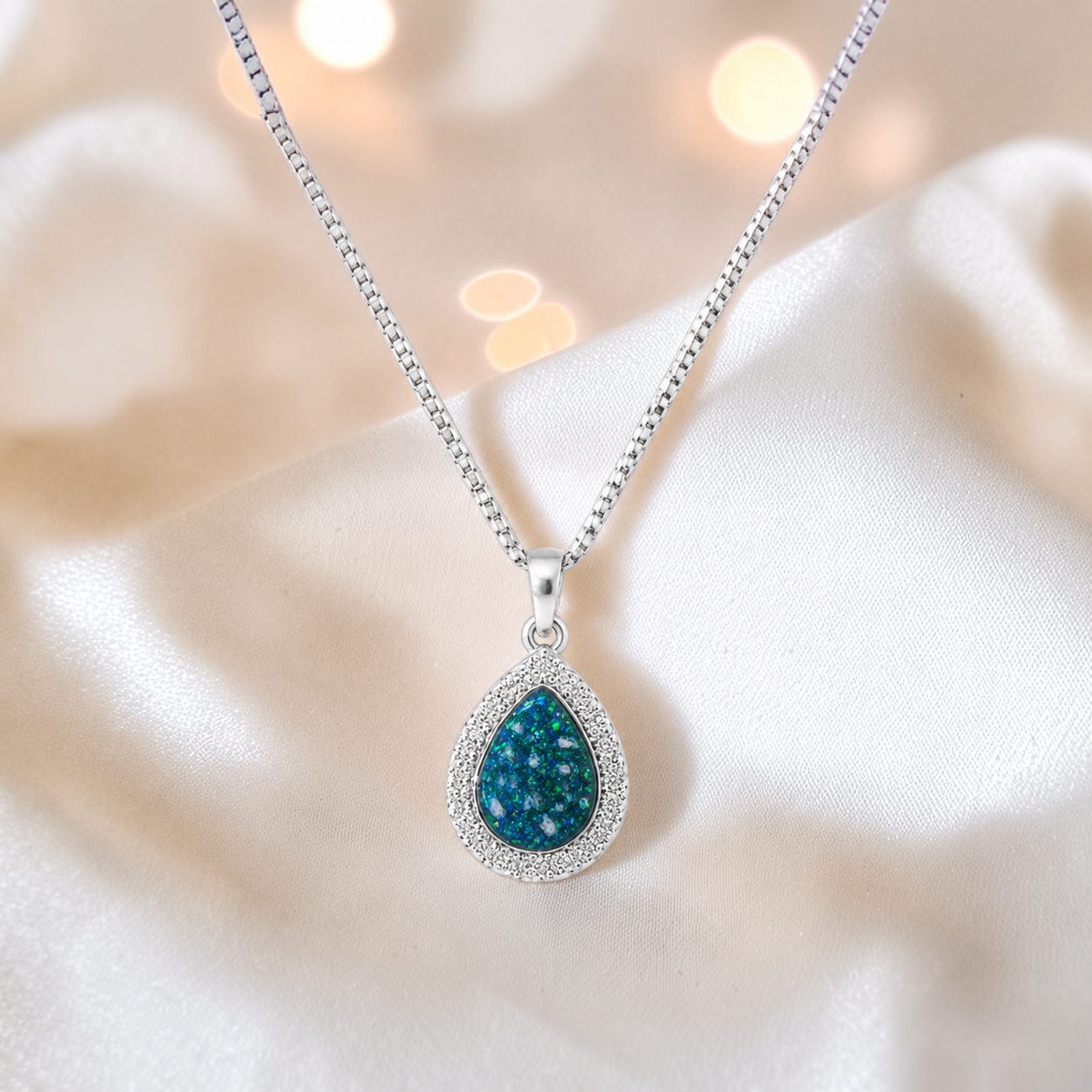Almara teardrop dainty CZ ashes pendant in teal mist, handcrafted in Lancashire UK - by Keepsake Memorial Jewellery
