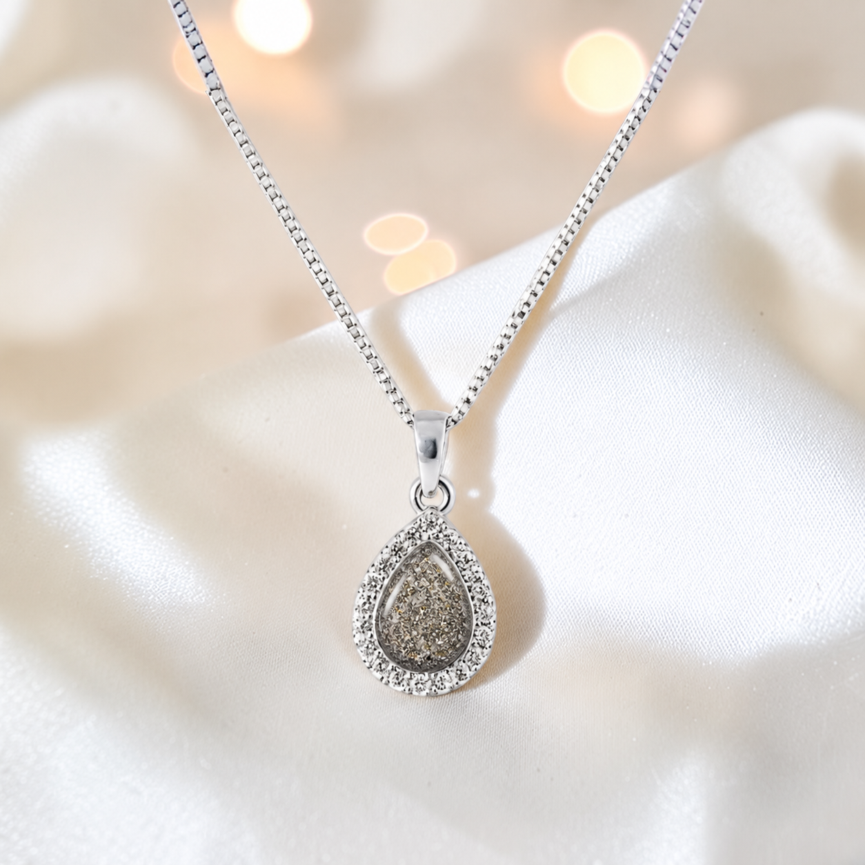 Almara teardrop dainty CZ ashes pendant in natural ash, handcrafted in Lancashire UK - by Keepsake Memorial Jewellery