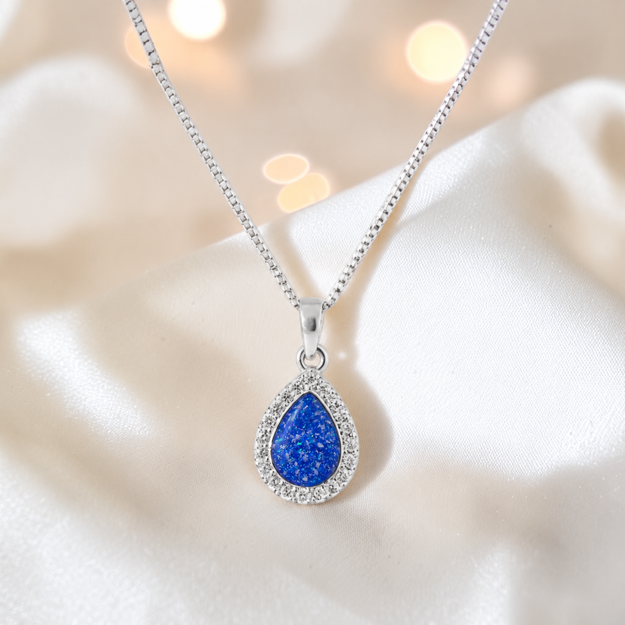 Almara teardrop dainty CZ ashes pendant in royal blue, handcrafted in Lancashire UK - by Keepsake Memorial Jewellery