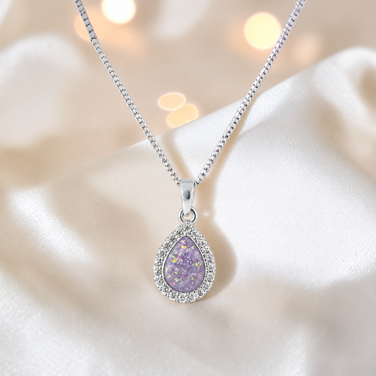 Almara teardrop dainty CZ ashes pendant in unicorn purple, handcrafted in Lancashire UK - by Keepsake Memorial Jewellery
