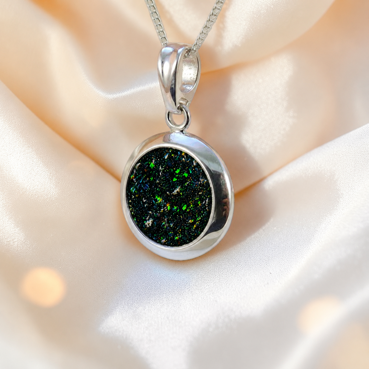 Altair round ashes pendant in black flame, handcrafted in Lancashire UK