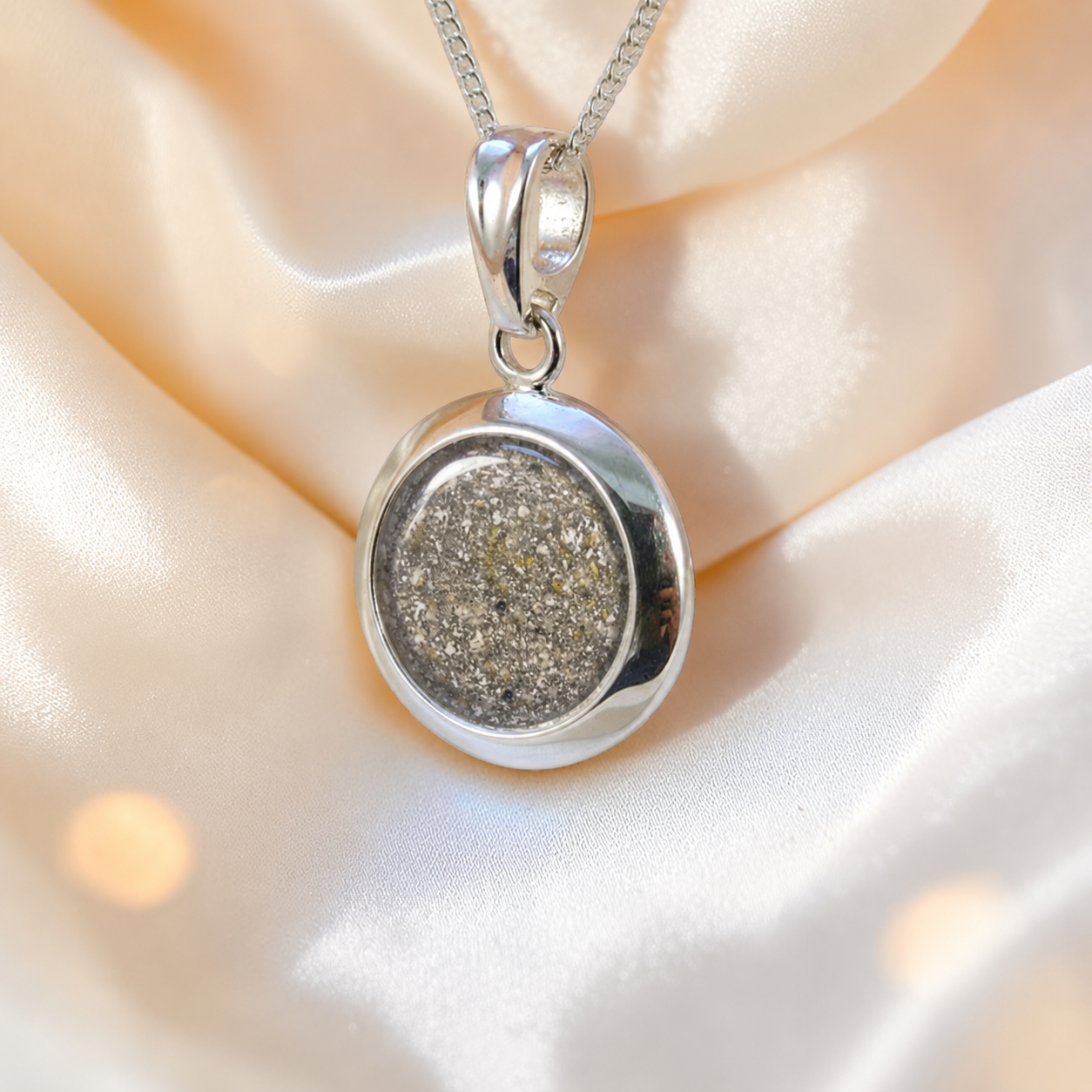 Altair round ashes pendant in natural ash, handcrafted in Lancashire UK