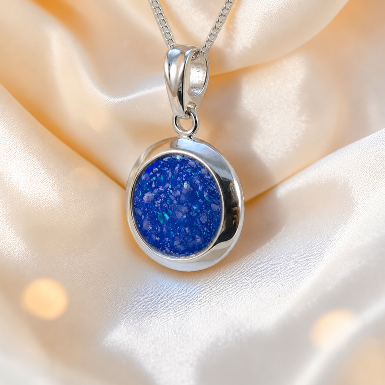 Altair round ashes pendant in royal blue, handcrafted in Lancashire UK