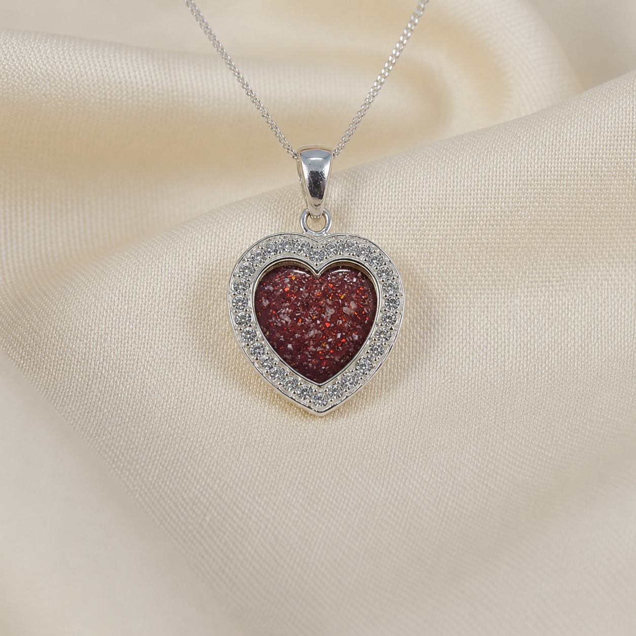 Antara Silver heart CZ shaped memorial pendant in ruby red, handcrafted in Lancashire UK