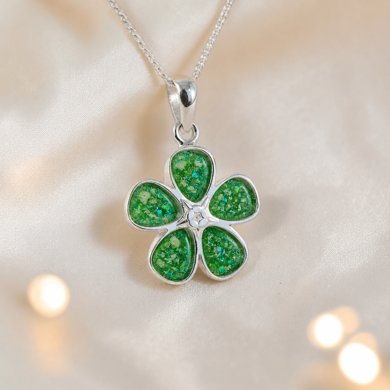 Arctura flower shaped ashes pendant in fruit green, handcrafted in Lancashire UK