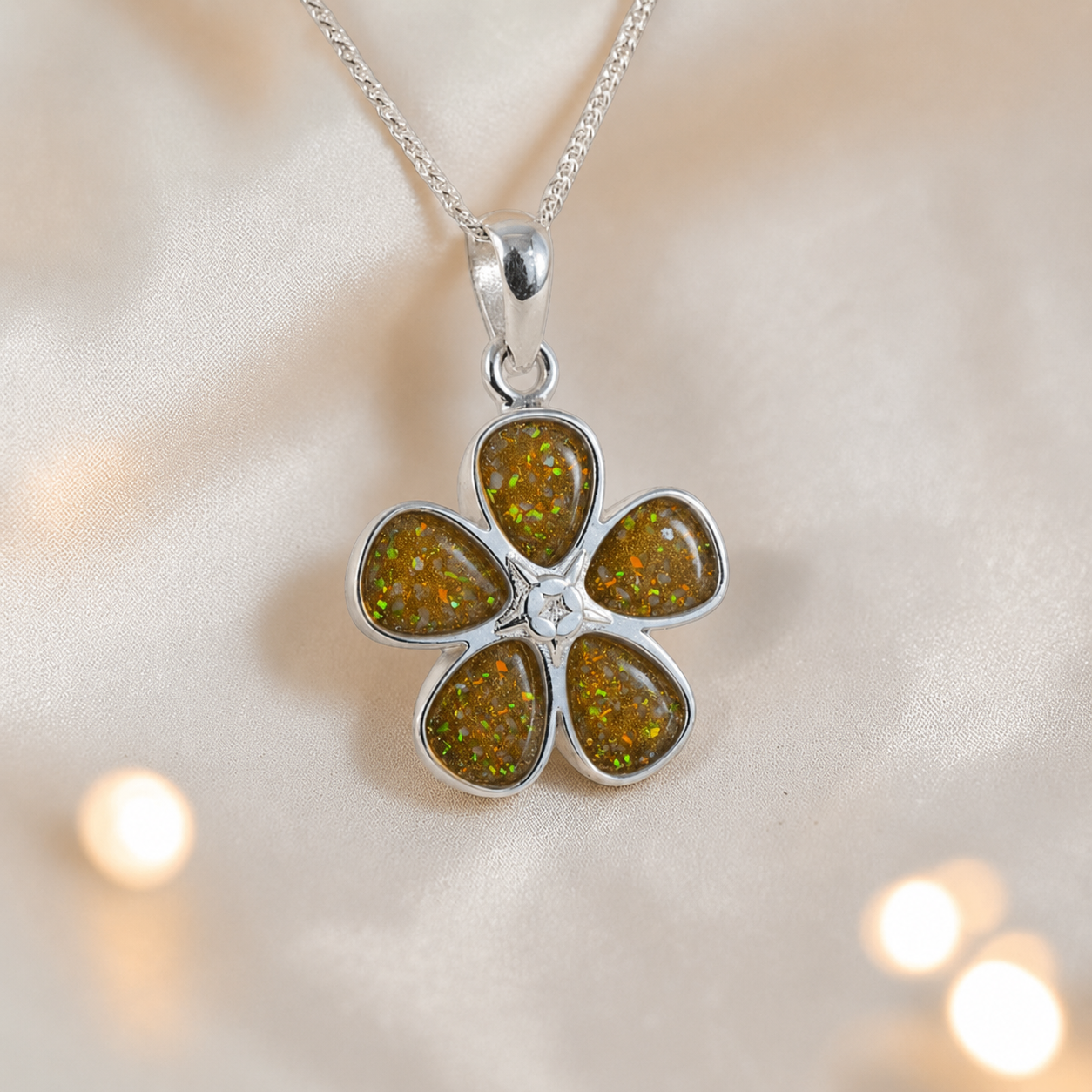 Arctura flower shaped ashes pendant in gold olive, handcrafted in Lancashire UK