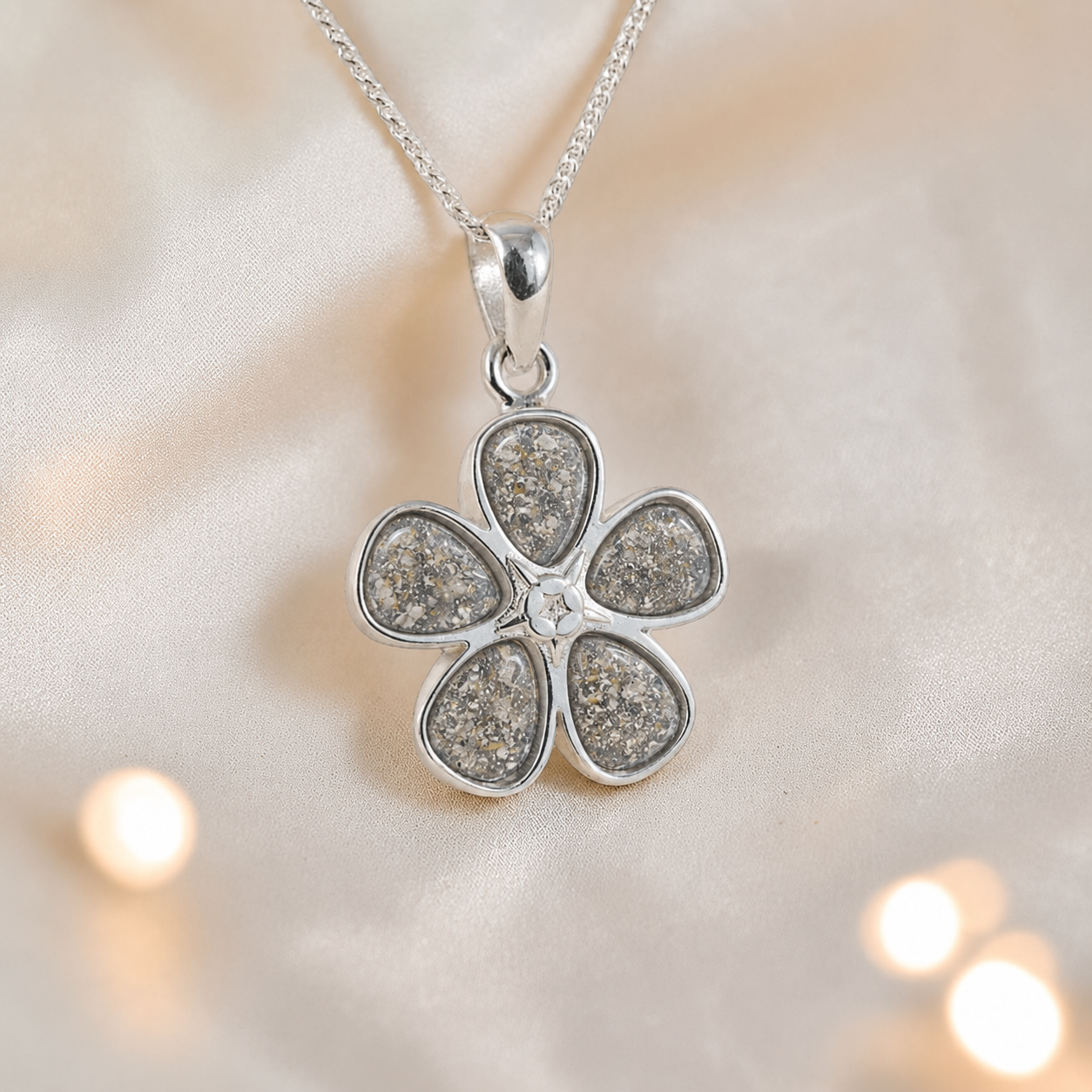 Arctura flower shaped ashes pendant in natural ash, handcrafted in Lancashire UK