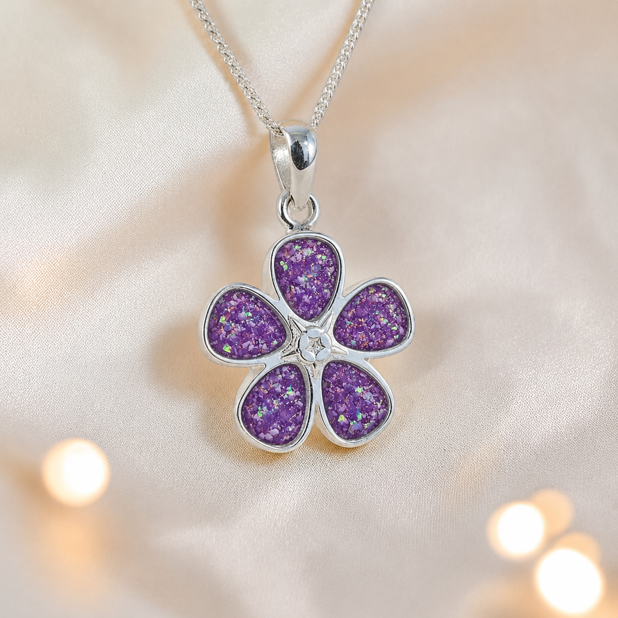 Arctura flower shaped ashes pendant in rose pink, handcrafted in Lancashire UK