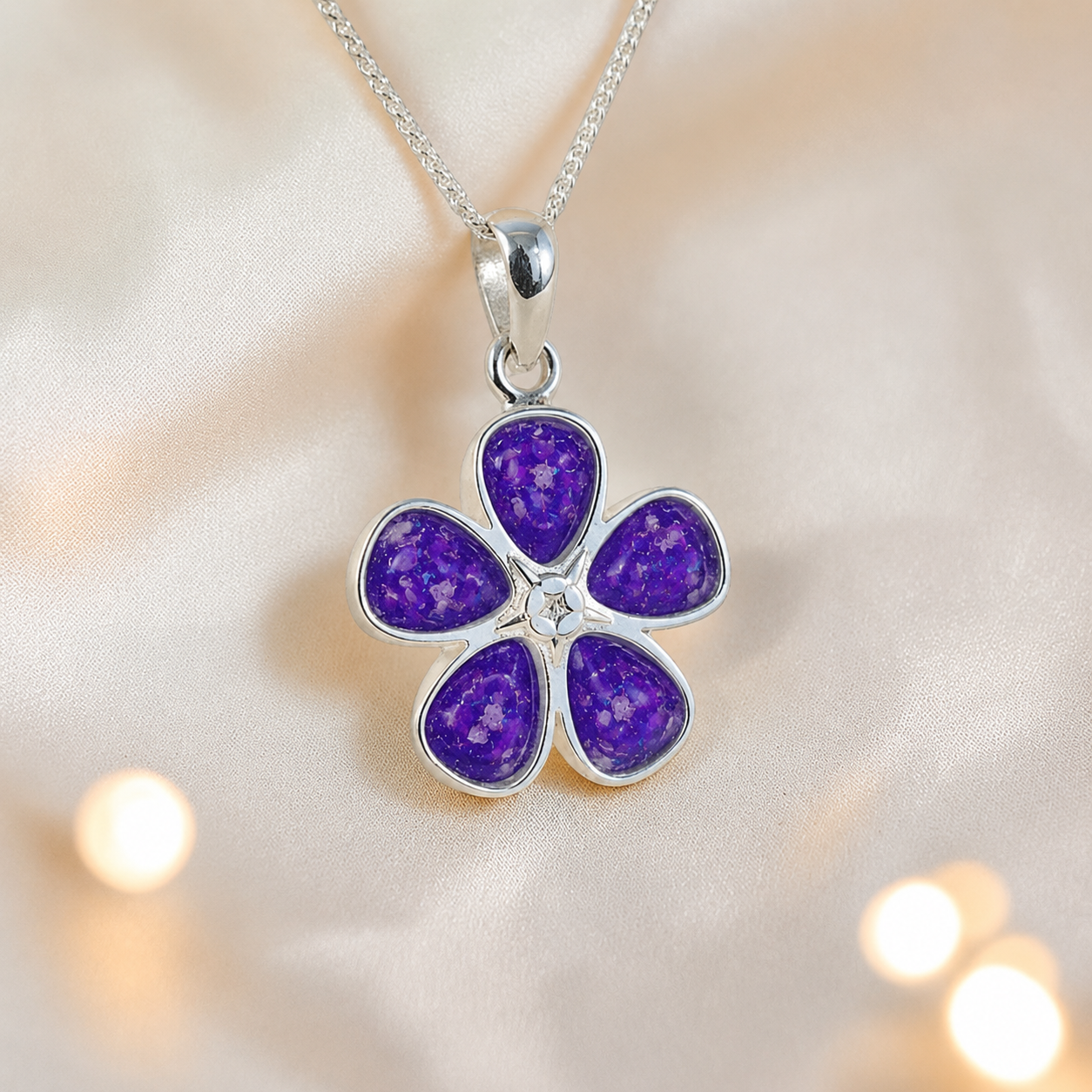 Arctura flower shaped ashes pendant in sleepy lavender, handcrafted in Lancashire UK